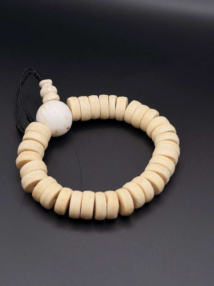 Brown Yak Bone Wrist Mala with Inlaid Brass Bead