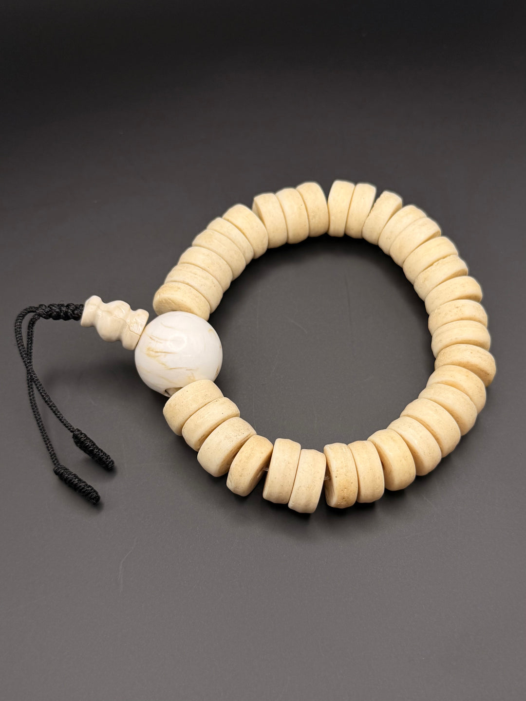 Brown Yak Bone Wrist Mala with Inlaid Brass Bead