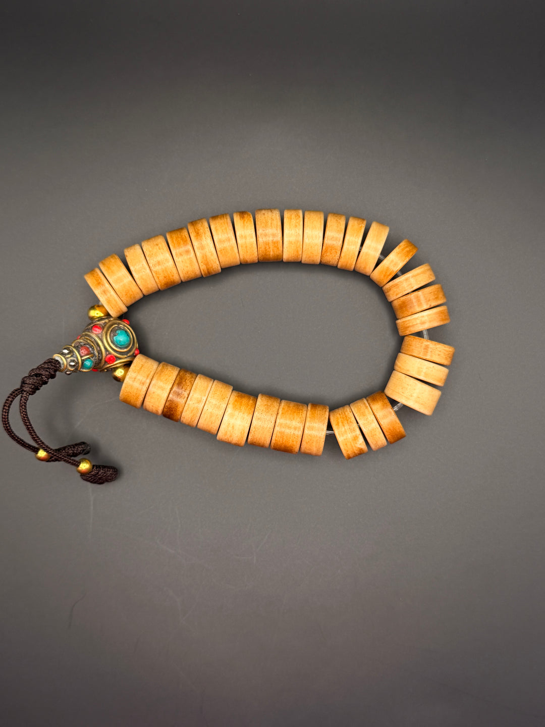 Brown Yak Bone Wrist Mala with Inlaid Brass Bead