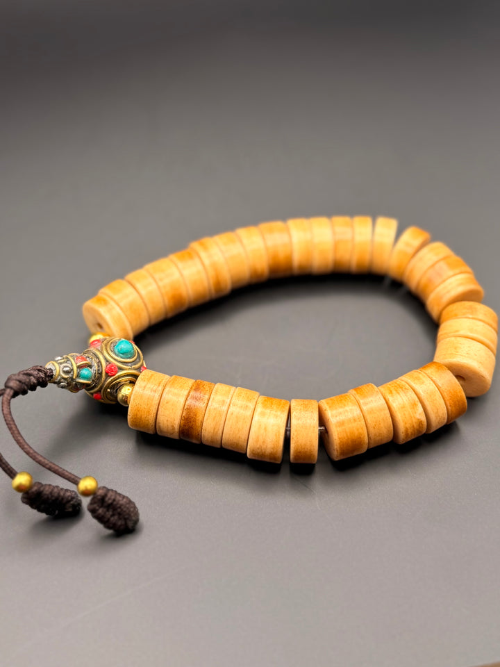 Brown Yak Bone Wrist Mala with Inlaid Brass Bead