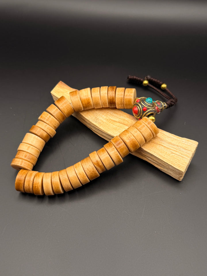Brown Yak Bone Wrist Mala with Inlaid Brass Bead