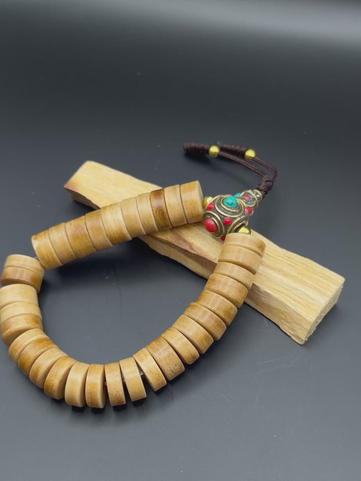 Brown Yak Bone Wrist Mala with Inlaid Brass Bead